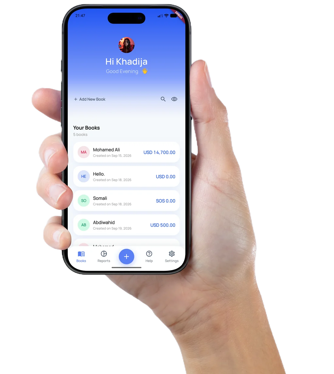 A hand holding a phone showing the Daftari cash book app, with a list of customer books and the balance owed on each one.